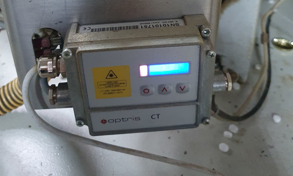 To address the challenges of fast thermal measurements, Optris has developed the specialized high-speed pyrometer, CTlaser 4M. This device is designed for ultra-fast temperature measurements, ensuring each crown cork is heated uniformly and correctly within the stringent timeframes required by modern manufacturing processes. The Optris CTlaser 4M is a cutting-edge pyrometer specifically designed for high-speed, low-temperature measurement applications in industries such as food packaging and traffic safety. Its exceptionally fast response time, capable of measuring temperatures within just 90 microseconds (Î¼s), is crucial for applications where products move rapidly through production lines, such as the high-speed sealing of crown caps. One key feature of the CTlaser 4M is its ability to measure temperature on very small spots accurately. This precision is achieved through its double laser sighting system, which precisely marks the measurement field. This feature is particularly important in ensuring the uniform heating of crown corks, where even slight deviations in temperature can lead to improper sealing and product quality issues. Additionally, the CTlaser 4M is built to withstand the demanding environments of high-speed manufacturing. It operates efficiently across a wide temperature range from 0  C to 500  C and can handle ambient temperatures up to 70  C. The device's robust construction, with an IP65 (NEMA-4) protection class, ensures it remains reliable and accurate even in harsh conditions. Integrating the CTlaser 4M into production lines is straightforward, thanks to its compact design and versatile mounting options. This allows manufacturers to incorporate the pyrometer into existing systems easily without significant modifications. The real-time data provided by the CTlaser 4M enables immediate adjustments, ensuring optimal temperature control and enhancing overall production efficiency. The CTlaser 4M is ideal not only for the food packaging industry but also for other high-speed applications such as PET preform temperature monitoring and railroad safety, where detecting overheating is critical. Its versatility and reliability make it a valuable tool for any industry requiring precise, high-speed temperature measurements.